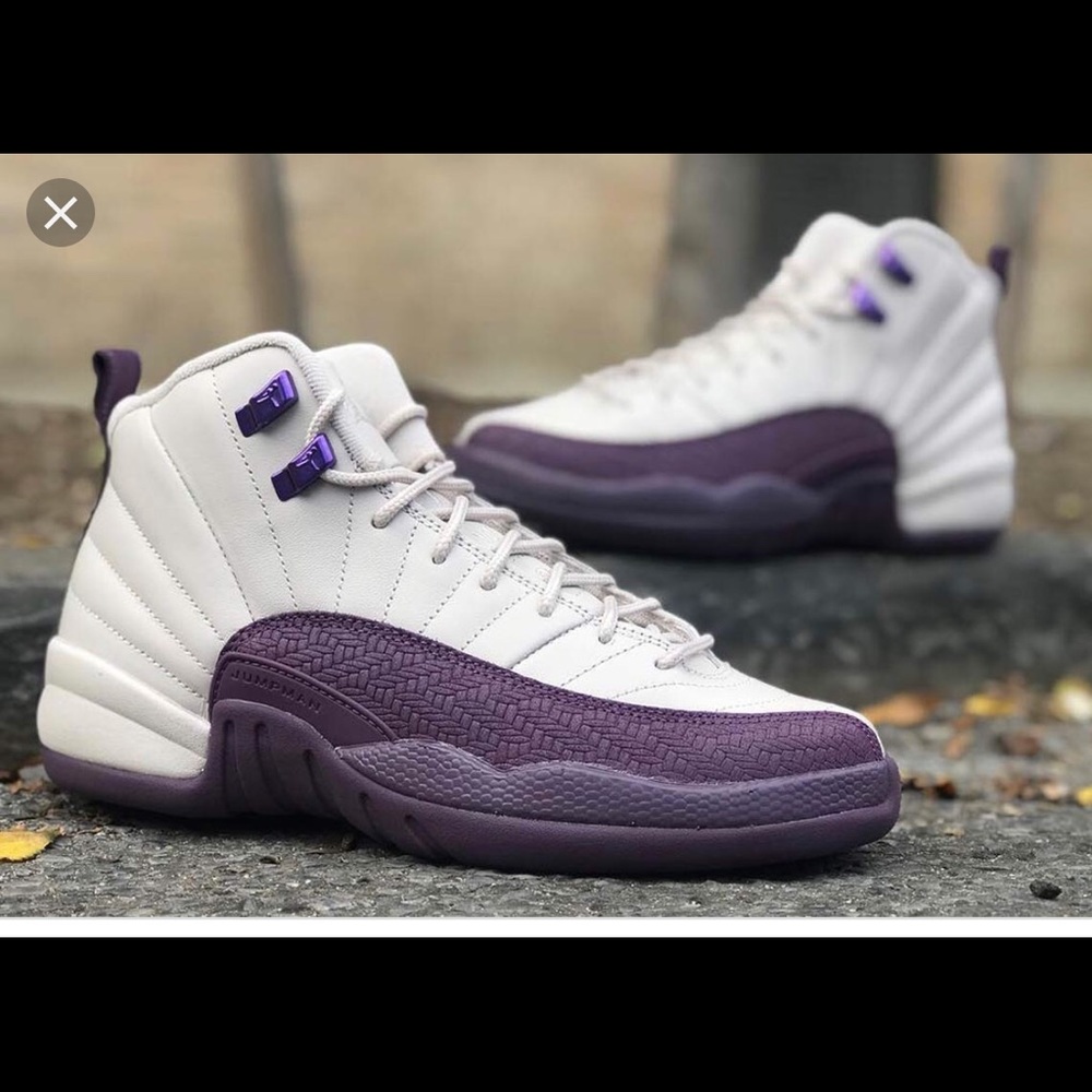 White and purple retro Jordans 12 or 23